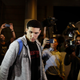 UCLA basketball player LiAngelo Ball is surrounded by the media as he leaves Los Angeles International Airport on Nov. 14, 2017, after his return from China. (Jae C. Hong/AP Images)
